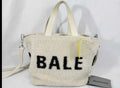 Balenciaga Cream Shearling Crossbody Tote with Black Lettering